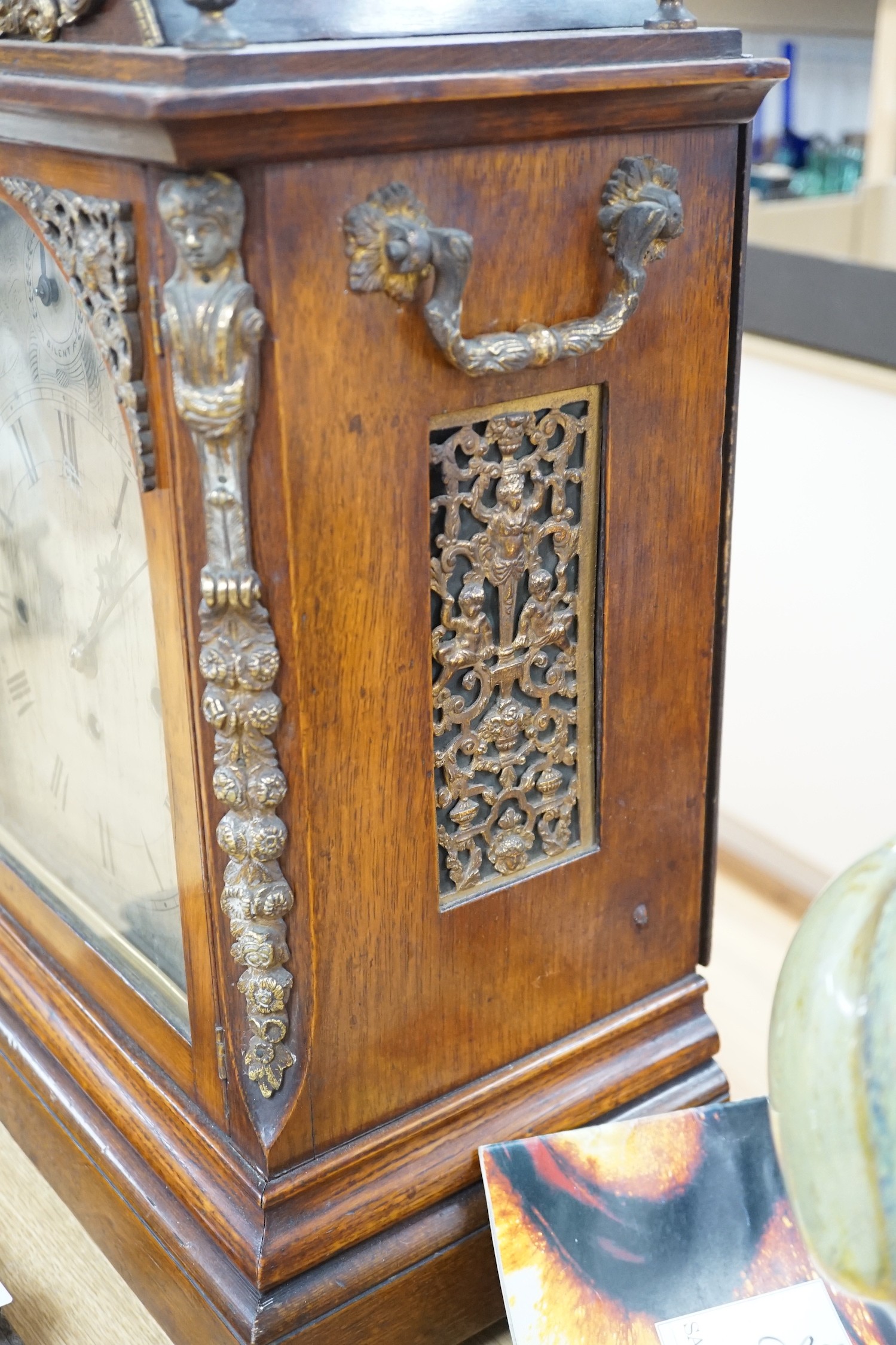 A late Victorian oak bracket clock with brass mounts and chiming movement, 55cms high